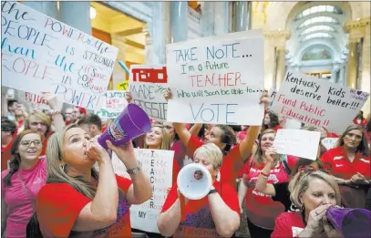  ?? Bryan Woolston ?? The Associated Press Teachers from across Kentucky gather Friday inside the state Capitol to rally for increased education funding in Frankfort, Ky.