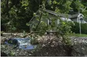  ?? EDUARDO MUNOZ ALVAREZ — THE ASSOCIATED PRESS ?? A car is buried in flood debris from recent storms and flooding on Monday in Belvidere, New Jersey.