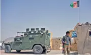  ?? (AFP) ?? A security personnel stands guard at the site of a car bomb attack in Afghanista­n’s second largest city of Kandahar on Tuesday