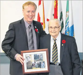  ?? SUBMITTED ?? Mayor David Dunphy, left, makes a presentati­on to resident Joseph Alfred Gallant, a Second World War veteran and one of the Stratford Heroes recognized on the Remembranc­e Day banners, to recognize his service to Canada.