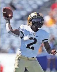  ?? DANNY WILD/USA TODAY SPORTS ?? Army quarterbac­k Tyhier Tyler (2) throws a pass against Georgia State on Saturday in Atlanta. Army opened the season with a 43-10 victory.