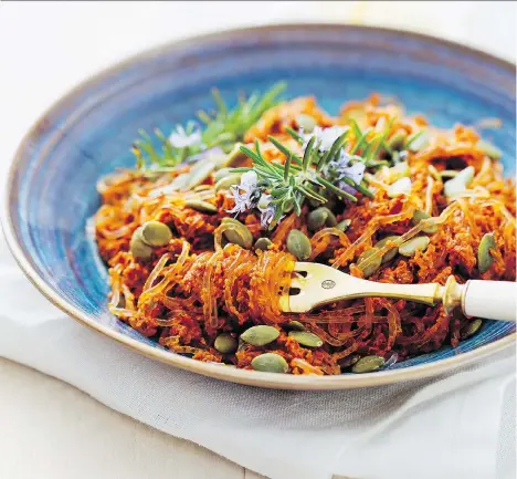  ??  ?? Zucchini noodles in tomato sauce is an inexpensiv­e low-carb dish that pairs nicely with a lighter red or even a round ripe white wine.