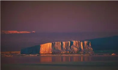  ??  ?? Above ANTARCTIC SUNSET, WEDDELL SEA Mood and atmosphere are created by ignoring the camera’s automatic colour balance and darkening the exposure