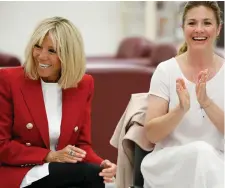  ??  ?? Brigitte Macron, wife of French President Emmanuel Macron, and Sophie Gregoire-Trudeau, wife of Canadian PM Justin Trudeau