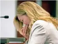  ??  ?? Claudia Brough, mother of fatalshoot­ing victim Colin Brough, wipes away tears at the Tuesday hearing.