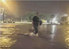  ??  ?? 0 Buildings were evacuated as Biloxi, Mississipp­i, suffered flooding