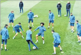  ??  ?? Real Madrid's players take part in a training session at the Valdebebas training ground in Madrid on Monday, the eve of the UEFA Champions League semi-final second-leg football match against Bayern Munich.