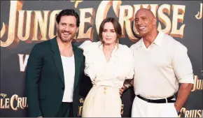  ?? Chris Pizzello / AP ?? From left, Edgar Ramirez, Emily Blunt and Dwayne Johnson, cast members in "Jungle Cruise," pose together at the world premiere of the film.