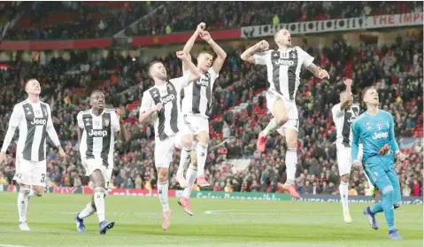  ?? — Reuters ?? Juventus’ Leonardo Bonucci and team mates celebrate after the Champions League Group H match against Manchester United at Old Trafford.