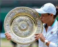  ?? SIMON BRUTY/AELTC/POOL/GETTY IMAGES ?? Australia's Ashleigh Barty celebrates with the Venus Rosewater Dish trophy after defeating Karolina Pliskova of The Czech Republic on Saturday in London.