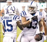  ?? AP/SETH WENIG ?? Indianapol­is Colts tight end Dwayne Allen (right) celebrates with teammate Phillip Dorsett (15) after scoring a touchdown against the New York Jets on Monday in East Rutherford, N.J. Allen finished with 4 catches for 72 yards and 3 touchdowns.
