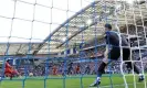  ?? Glyn Kirk/AFP/Getty Images ?? Mohamed Salah converts a penalty for his second goal at the Amex Stadium. Photograph: