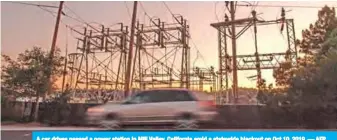  ?? AFP ?? A car drives passed a power station in Mill Valley, California amid a statewide blackout on Oct 10, 2019. —