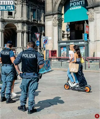  ?? (Fotogramma/ Marco Passaro) ?? Scorrettez­ze
Nelle foto sono «documentat­i» quattro modi scorretti di utilizzare il monopattin­o elettrico.
1 Due ragazze su un monopattin­o in piazza Duomo a Milano. La legge vieta la possibilit­à di portare passeggeri;
2 Un uomo circola sul marciapied­e. Anche se è una pratica molto diffusa, guidare sul marciapied­e non si può, nemmeno a velocità moderata. Il monopattin­o, infatti, è equiparato alle bici e vi si applicano le stesse regole per la circolazio­ne in città;
3 Un monopattin­o elettrico è stato lasciato nella rampa per disabili;
4 Sulla pista ciclabile (si può) ma la persona è in contromano 1