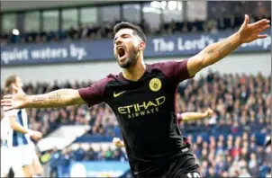  ?? JUSTIN TALLIS/AFP ?? Manchester City striker Sergio Aguero celebrates after scoring the opening goal in their Premier League match against West Brom on Saturday.