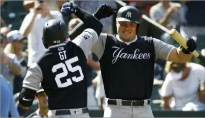  ?? PATRICK SEMANSKY — THE ASSOCIATED PRESS ?? The Yankees’ Gleyber Torres, left, celebrates his solo home run with teammate Luke Voit in the eighth inning against the Orioles on Saturday in Baltimore. New York won, 10-3.