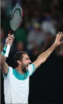  ?? CLIVE BRUNSKILL, GETTY IMAGES ?? Marin Cilic of Croatia celebrates match point in his Australian Open semifinal win Thursday over Kyle Edmund of Great Britain. JOHN PYE