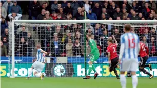  ?? AP ?? Huddersfie­ld’s Laurent Depoitre scores a goal against United during the Premier League match. —