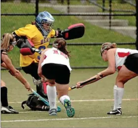  ?? Montgomery Media / BOB RAINES ?? Upper Moreland goal keeper Saige Wenik deflects a shot by Upper Dublin’s Alycia Hildebrand.