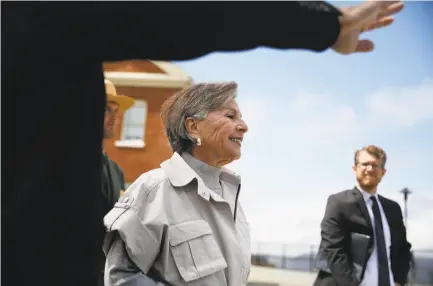  ?? Lea Suzuki / The Chronicle ?? Sen. Barbara Boxer walks with the Presidio Trust’s Michael Boland (left) to the site of the planned Presidio Tunnel Tops.