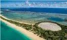  ??  ?? The Runit dome, a concrete sarcophagu­s filled with nuclear waste on Runit Island, beside a crater left by another nuclear test. Photograph: Greg Nelson