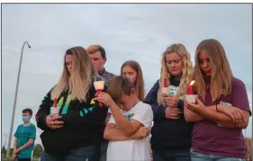  ?? (AP/The Idaho Post-Register/John Roark) ?? Visitors pray Friday during a memorial service for Tylee Ryan and Joshua “JJ” Vallow in Idaho Falls,
Idaho.