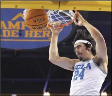  ?? Associated Press ?? UCLA guard Jaime Jaquez Jr. dunks during the first half of an NCAA college basketball game against North Florida on Wednesday in Los Angeles.