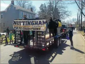  ?? PHOTOS BY SULAIMAN ABDUR-RAHMAN - THE TRENTONIAN ?? The 2017-18 Nottingham High School boys basketball Group III state champions cruise down Mercer Street as part of the annual Hamilton Saint Patrick’s Day Parade on Saturday.