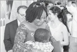  ?? Jorge Arbona Lopez Ceuta City Council ?? ADOU OUATTARA, 8, is returned to his mother, Lucille, in Ceuta, a Spanish enclave in northweste­rn Africa. He had been kept at a care facility for a month.