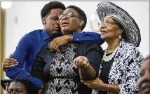  ?? SHABAN ATHUMAN / DALLAS MORNING NEWS ?? Grant Jean (from left) and his mother, Allison Jean — brother and mother of Botham Jean — mourn with another churchgoer during a prayer service in Dallas on Sunday.