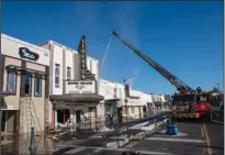  ?? CRAIG SANDERS/STOCKTON RECORD ?? A five-alarm fire at the Empire Theatre on Pacific Avenue on Friday. Fire fighters cleared the building on arrival and then moved to an outside attack for safety concerns.
