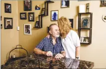  ?? ROGER KISBY / THE NEW YORK TIMES ?? Lawrence Sedita, 74, and his wife, Tracey Hilts-sedita, hug at their home in Las Vegas. The rate of those 65 and older filing for bankruptcy is three times what it was in 1991, a new study finds, as more enter their later years in a precarious position. Sedita is a former carpenter who lost his health insurance two years ago after being on disability since 1991.