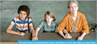  ?? — AP photos ?? This image released by Roadside Attraction­s shows Jaden Michael, from left, Oakes Fegley and Julianne Moore in a scene from “WonderStru­ck”.