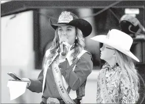  ?? MARK HUMPHREY ENTERPRISE-LEADER ?? Technologi­cal cowgirl, Loran Lopez, 2016 Lincoln Riding Club Rodeo queen, packs her cellphone, while introducin­g 2017 Lil’ Mister and Lil’ Miss contestant­s. Lopez was accompanie­d by 2016 LRC Princess Mika Arnold, now a candidate for 2018 LRC junior...