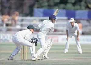  ?? DAVID MUNDEN/GETTY IMAGES ?? Sanjay Manjrekar batting for India during his innings of 104 runs in the inaugural Test match between Zimbabwe and India at the Harare Sports Club, 21st October 1992. The Zimbabwe wiketkeepe­r is Andy Flower. The match ended in a draw.
