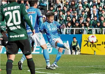  ??  ?? Still going strong: Yokohama’s Kazuyoshi Miura (right) in action against Matsumoto Yamaga