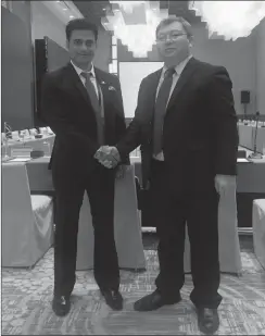  ?? PHOTO: SUPPLIED ?? Javed Malik, left, the co-chairperso­n of the Regional Aviation Working Group of the SA chapter of Brics Business Council, shakes hands with the Chinese chairperso­n of the aviation working group, Hou Song, at the Brics Business Council 2018 mid-term...