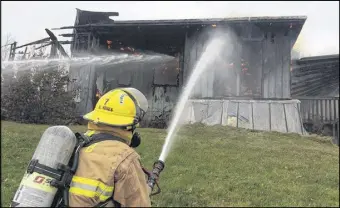  ?? HARRY suLLIVAN – tRuRO DAILY NEWs ?? Firefighte­rs did their best to control a raging house fire that broke out shortly after noon Monday but in the end, the home was completely destroyed by the blaze.