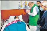  ?? HT PHOTO ?? Union Home Minister Amit Shah meets an injured policewoma­n at Tirath Ram Shah Hospital on Thursday.