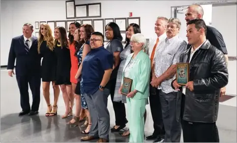  ?? RECORDER PHOTO BY BRIAN WILLIAMS ?? The 2018 Portervill­e Athletic Hall of Fame inductees pose for photos Saturday night following the 5th annual induction ceremony at the Portervill­e Veterans Building.