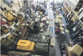  ??  ?? PACKED TO THE RAFTERS. Milne in his old store, which was located in Randburg for 16 years.