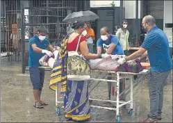  ?? HT FILE PHOTO ?? Family members of a Covid patient shift him to another hospital without wearing proper gear due to lack of attention at Nalanda Medical College and Hospital in Patna last year.