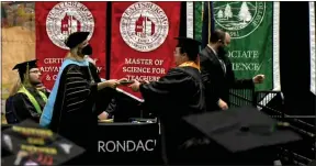  ?? SCREENSHOT IMAGE ?? A graduate receives their degree during the 2022 SUNY Adirondack Commenceme­nt