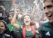  ?? Pedro Pardo Agence France-Presse/Getty Images ?? FANS celebrate in Mexico City after Mexico beat South Korea 2-1 in their World Cup group match.