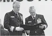  ?? DAVE RESS/STAFF ?? Rear Adm. Keith Smith l, receives the Legion of Merit.