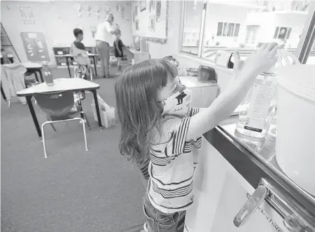  ?? AL SEIB/LOS ANGELES TIMES 2020 ?? Student Jackson Middleton uses hand sanitizer in the classroom in Palos Verdes, California.