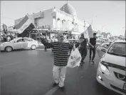  ??  ?? A PEDDLER sells Iraqi f lags on a street in Kirkuk a day after Kurdish forces handed over the city.