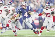  ?? Adam Glanzman / Getty images ?? Jarrett Stidham of the Patriots rushed for 50 yards and threw for 225 in his bid for the backup quarterbac­k spot.