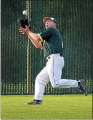  ?? GENE WALSH — DIGITAL FIRST MEDIA ?? Nor-Gwyn left fielder Bob Filler reaches for the ball during Game 1 of the Packers’ Perky League semifinal series against Ambler Thursday at Temple-Ambler.