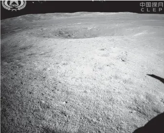  ?? Associated Press ?? The China National Space Administra­tion released this first image of the moon’s far side taken by China’s Chang’e-4 probe, which is relaying data from a moon satellite launched earlier.